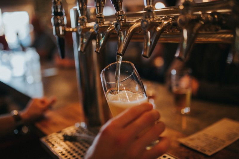 Pub by Amie Johnson pouring glass of beer