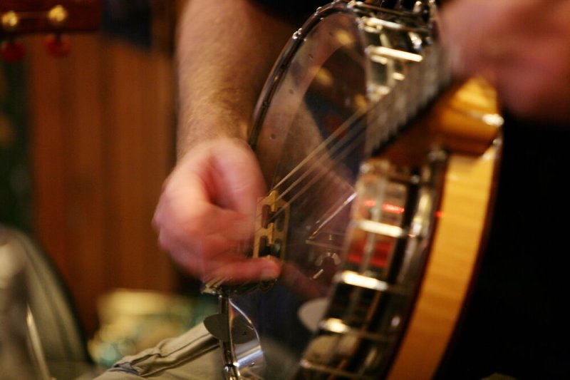 Traditional Irish Music man playing guitar in bar